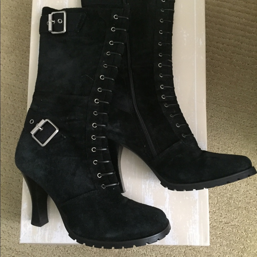 Black suede mid thigh boots.